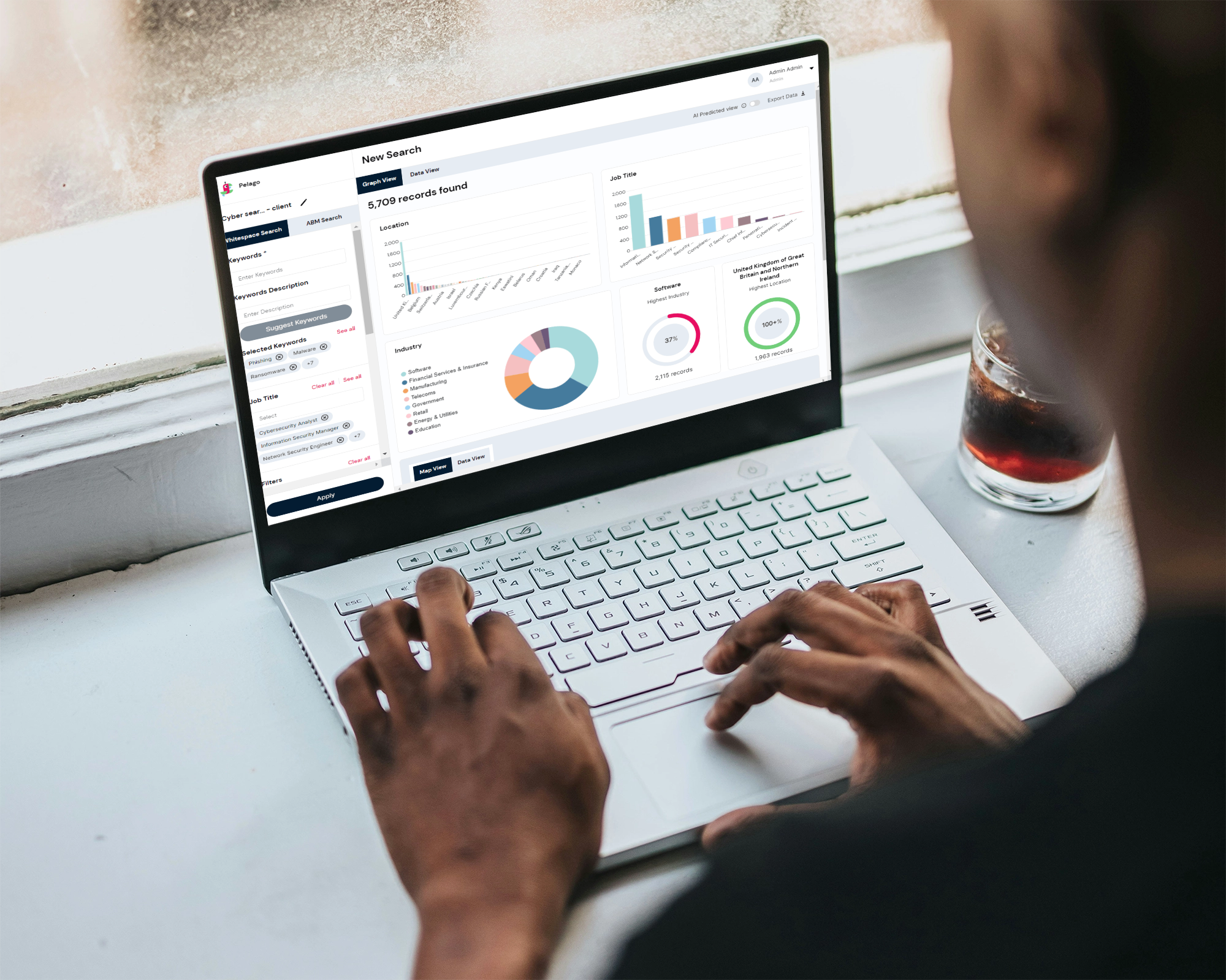 A man using laptop with screen mockup